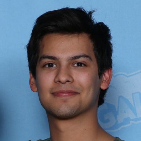 Xolo Maridueña poses a picture during an event.